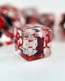 Clear dice with red numbers on a white surface