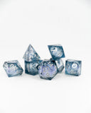 Set of blue and silver polyhedral dice on a white background