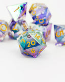 Set of colorful polyhedral dice with numbers on a white background
