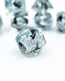 Clear polyhedral dice with black numbering on a white background