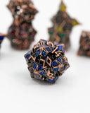 Geometric metal sculpture with blue and bronze colors on a white background