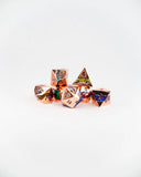 Set of metallic polyhedral dice on a white background