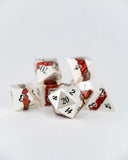 Set of dice with red and white design on a light gray background