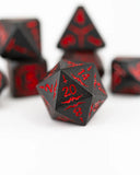 Black dice with red numbering on a white background