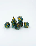 Set of polyhedral dice with teal and gold colors on a white background