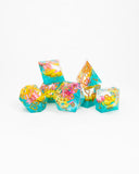 Set of colorful die-shaped candies on a white background