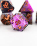 Purple polyhedral dice with orange numbers on a white background