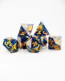 Set of blue and gold polyhedral dice on a white background