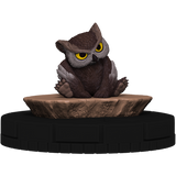 Owl figurine on a rock-like base with a white background