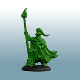 Green warrior figurine with a spear on a light blue background