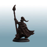 Dark brown warrior figurine with a spear on a light blue gradient background