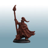 Brown figurine of a warrior holding a spear on a light blue background