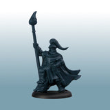 Dark gray fantasy figurine with a spear on a light gray background