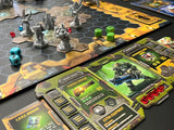 Board game with hexagonal tiles and character figures on a dark surface