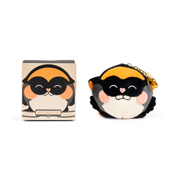 Penguin-shaped keychain with packaging on a white background