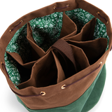 Green and brown bag with interior compartments on a white background