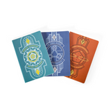 Three notebooks with geometric designs on a white background