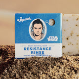 Bar of soap with 'Resistance Rinse' packaging featuring a character from 'Star Wars' on a textured brown background.