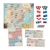 Board game components including a map of France, cards, and rule sheets on a white background