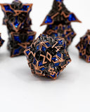 Close-up of metallic dice with blue gemstones on a white background