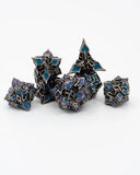 Set of polyhedral dice with black, blue, and purple design on a white background