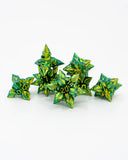 Green and yellow geometric star-shaped objects on a white background