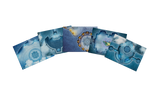 Four rectangular printed pieces with blue-toned fantasy or sci-fi mechanical illustrations, arranged in a fan shape on a plain white background.