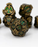 Close-up of ornate dice with gold and green details on a white background