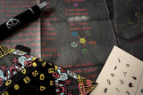 Close-up of a deck of cards with colorful designs and text on a dark surface.