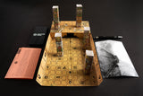 Board game setup with pieces and instructions on a dark surface
