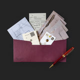 Collection of cards and a pen on a dark background