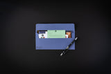Blue envelope with stationery items on a black background