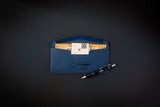 Blue envelope with a document and pen on a dark background