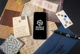 Phone with 'MOBILE ESCAPE' app on a surface with maps and cards