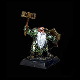 Miniature figurine of a warrior holding a hammer on a black background