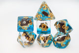 Set of polyhedral dice with blue, clear, and gold colors on a white background