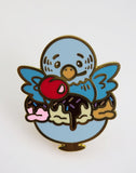 Colorful enamel pin of a bird with ice cream sundae design on a white background