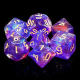 A set of translucent purple and blue polyhedral gaming dice with gold-colored numbers, arranged on a reflective black surface.