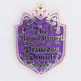 Decorative pin with 'The Royal Court of Princess Donul' text on a purple background