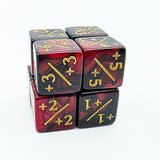 Set of red and black dice with gold numbering on a white background