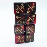 Set of dice with red and black marbled pattern and gold numbering on a white background