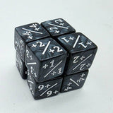 Set of black dice with white numbers and symbols on a light gray background