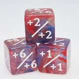 Marbled red and blue dice with mathematicalnotations on a white background