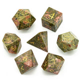 Set of green and brown dice with gold numbers on a white background