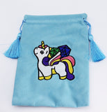 Light blue drawstring bag with a colorful unicorn patch on a white background