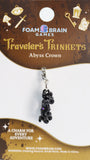Foam Brain Games Travelers Trinkets Abyss Crown charm on a display card.