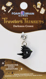 Black dragon charm on a 'Foam Brain Games' branded card