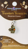 Charm on a Foam Brain Games card with 'Traveler's Trinkets Dwarven Crown' text.