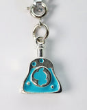Turquoise and silver charm on a white background