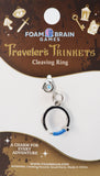 Traveler's Trinkets Cleaving Ring charm on Foam Brain Games packaging